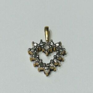 Pendant, one side is diamond, the other side is rubies. Genuine. 10k gold.